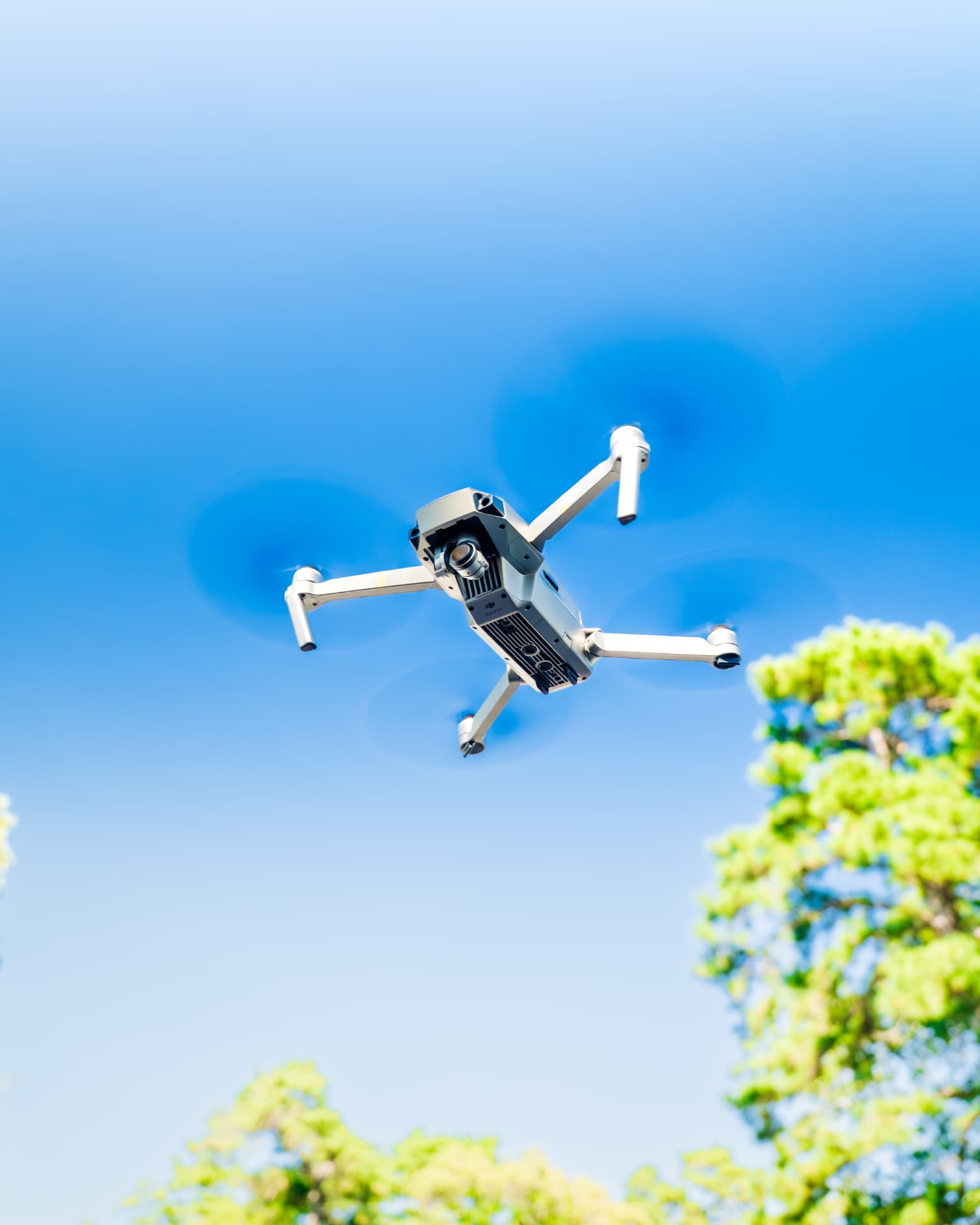 Quadcopter drone in flight over a residential construction site