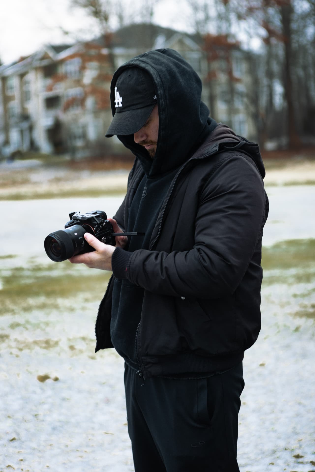 Mike reviewing a shot on his camera on location in winter