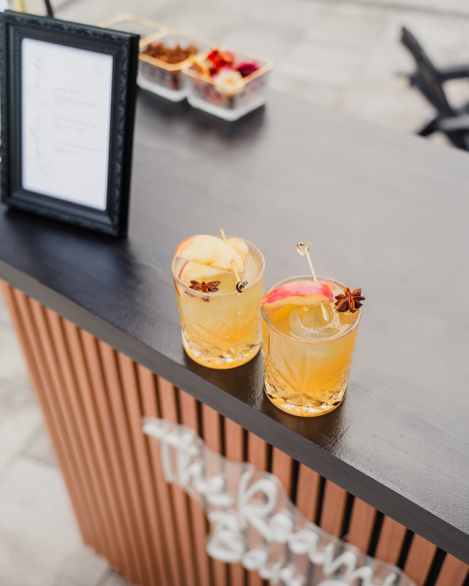 Top-down view of signature cocktails at The Roam Bar outdoor bar